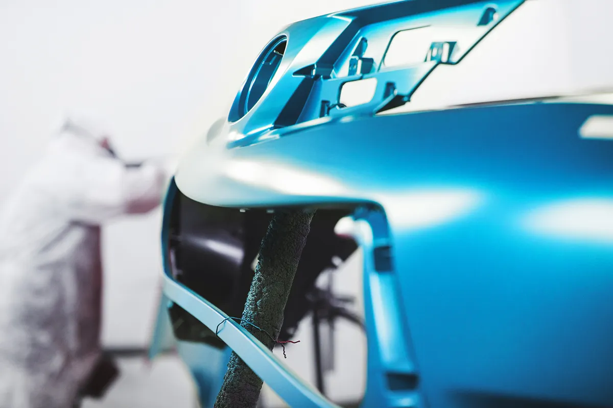 Close-up of professionally painted vehicle bumper at AutoBody by Fisher in Anna, TX